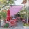 outdoor patio with covering and chairs and tables